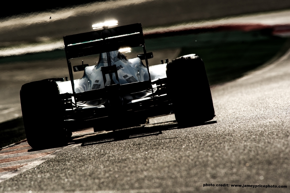 Formula 1 car photographed from behind on a curve
